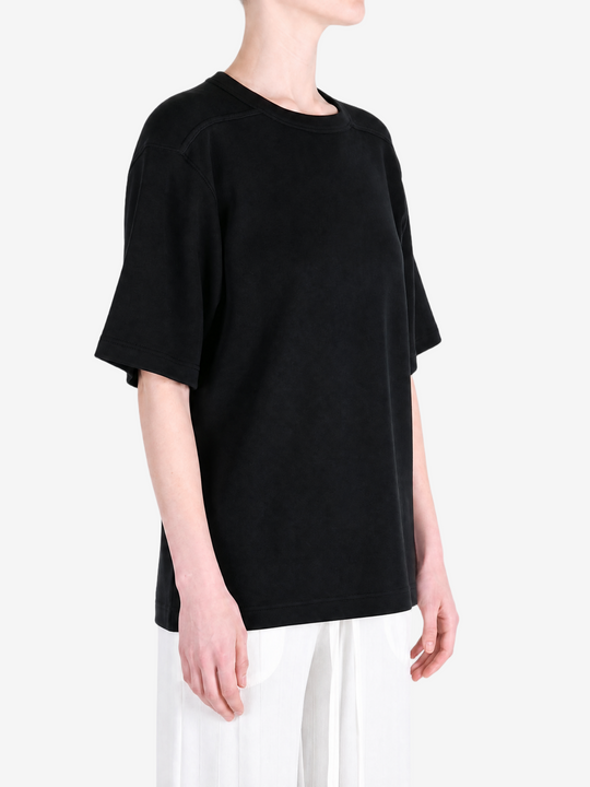 Black t-shirt worn by a person, showing the t-shirt fit