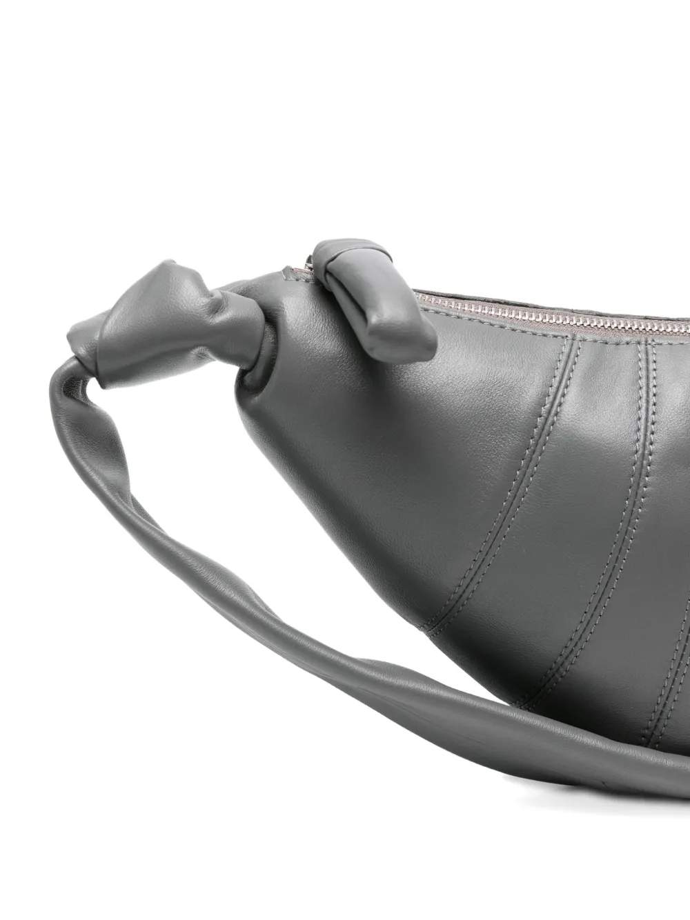 Close up of the grey bag, showing texture of the leather fabric