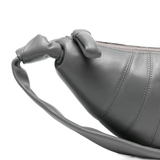 Close up of the grey bag, showing texture of the leather fabric