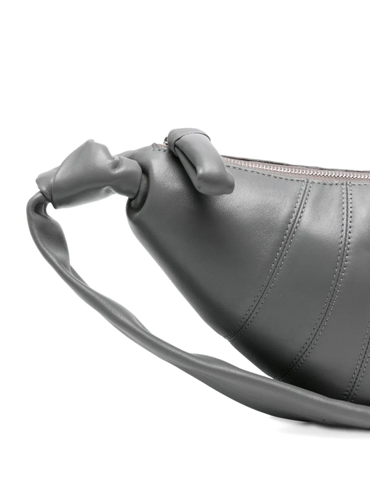 Close up of the grey bag, showing texture of the leather fabric