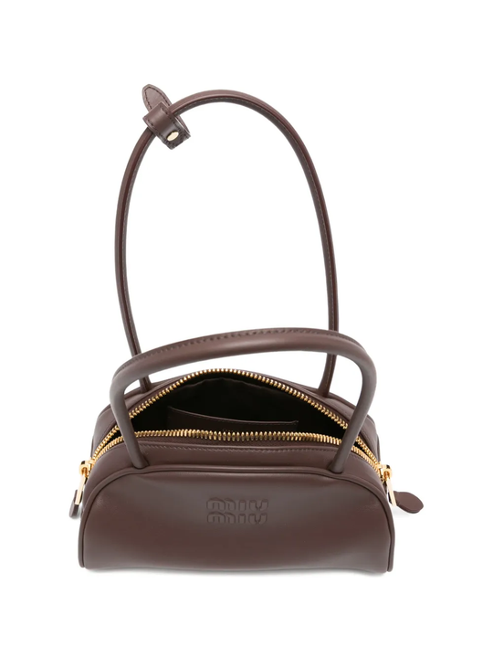 Close up of brown bag, showing texture of the calf leather fabric