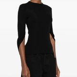 black t-shirt worn by a person, showing the t-shirt fit