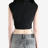 black sleeveless top worn by a person, showing the top fit