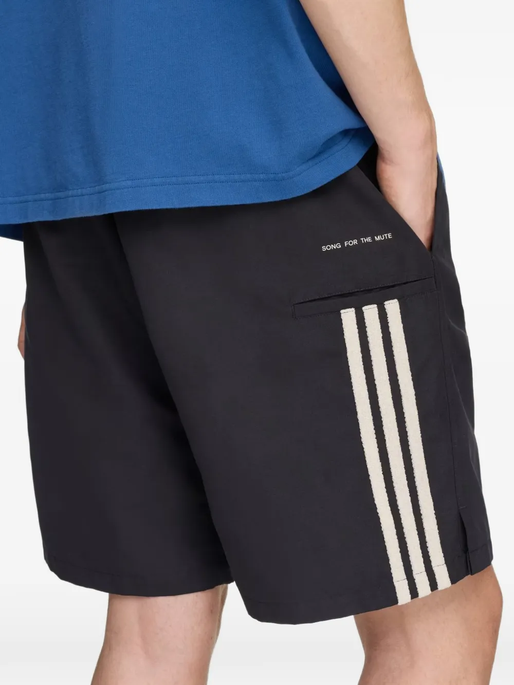 Black shorts worn by a person, showing the shorts' fit