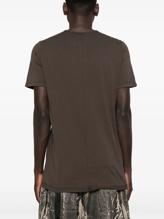 Brown t-shirt worn by a person, showing the shirt's fit