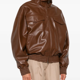 Brown jacket worn by a person, showing the jacket's fit