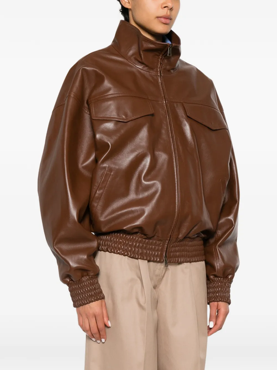 Brown jacket worn by a person, showing the jacket's fit