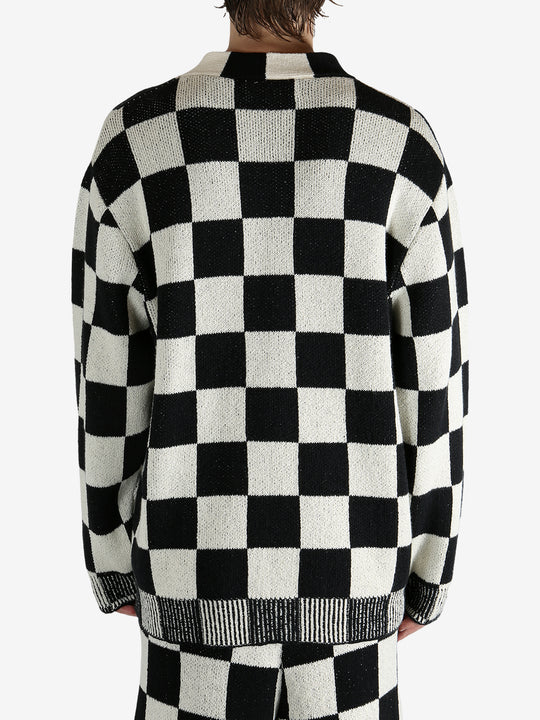 Black cardigan worn by a person, showing the cardigan’s fit