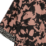 Close up of red shirt, showing texture of the viscose fabric