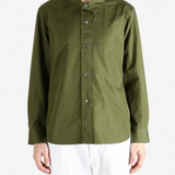 Green shirt worn by a person, showing the shirt fit