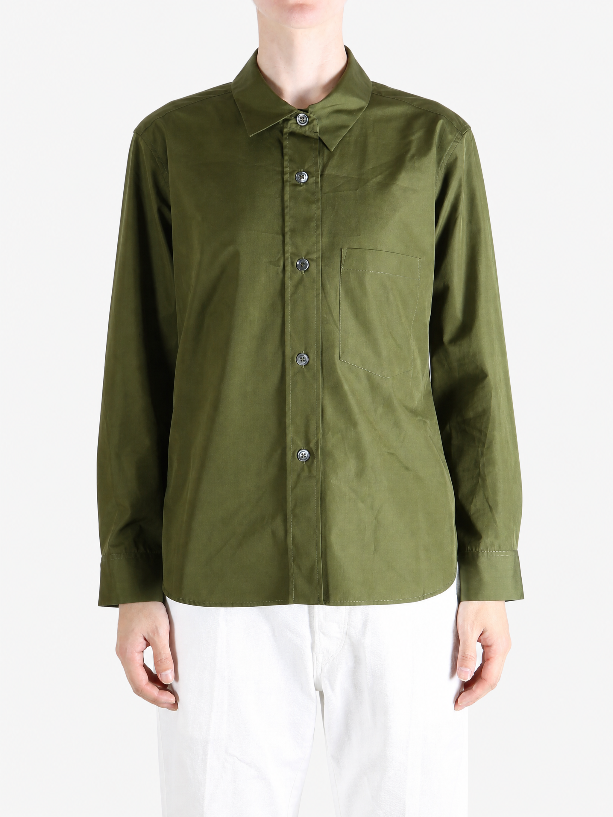 Green shirt worn by a person, showing the shirt fit