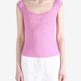 Pink top worn by a person, showing the top fit