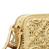 close up of tan bags, showing texture of the raffia fabric