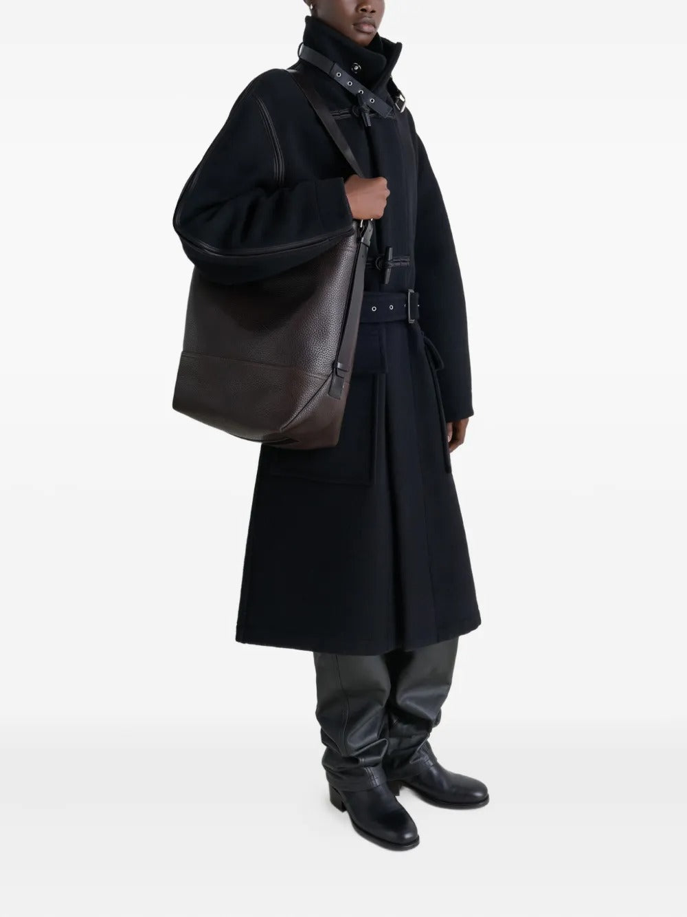 brown bag carried by a person, showing the size of the bag