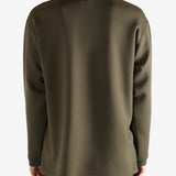 Brown pullover worn by a person, showing the pullover 's fit