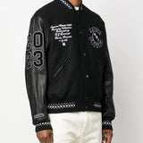 Black jacket worn by a person, showing the jacket fit