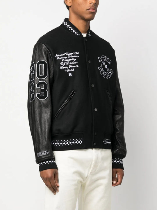 Black jacket worn by a person, showing the jacket fit
