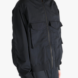 Black jackets worn by a person, showing the jackets fit