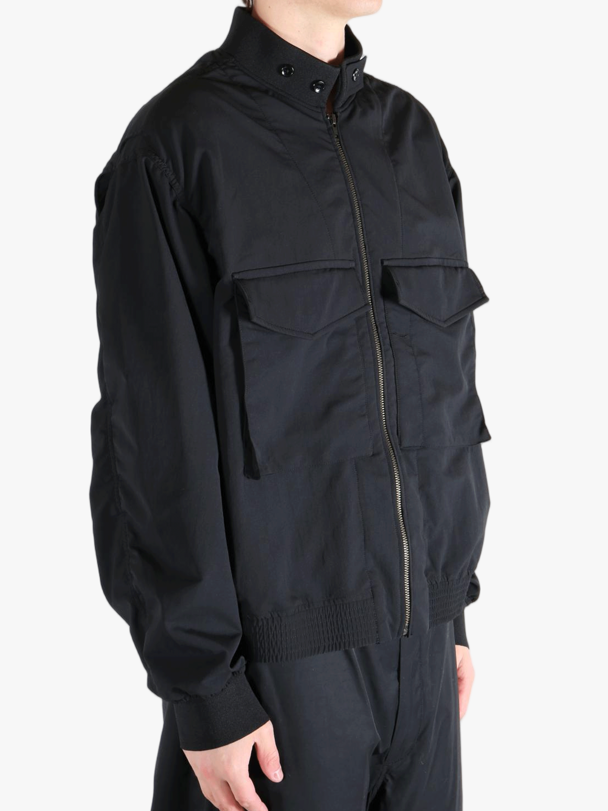 Black jackets worn by a person, showing the jackets fit