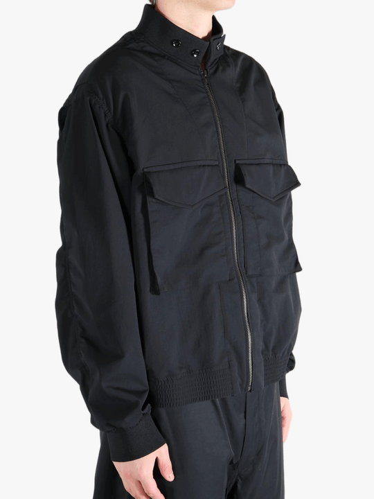 Black jackets worn by a person, showing the jackets fit