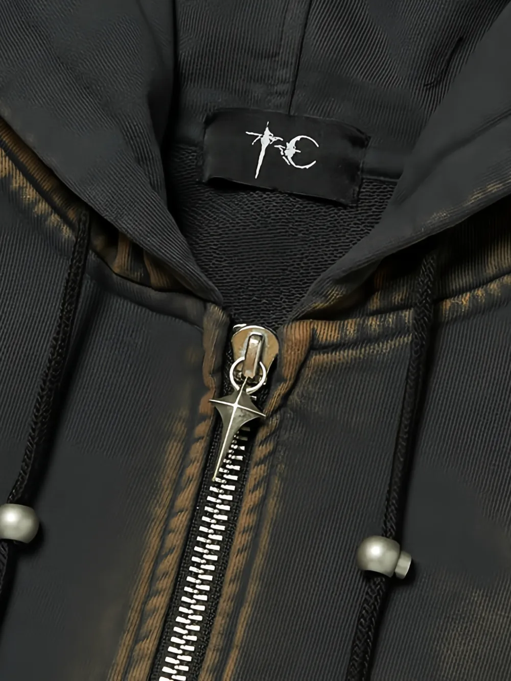 Close up of black hoodie, showing texture of the Cotton fabric