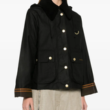 Black jacket worn by a person, showing the jacket fit