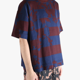 Blue t-shirt worn by a person, showing the t-shirt fit