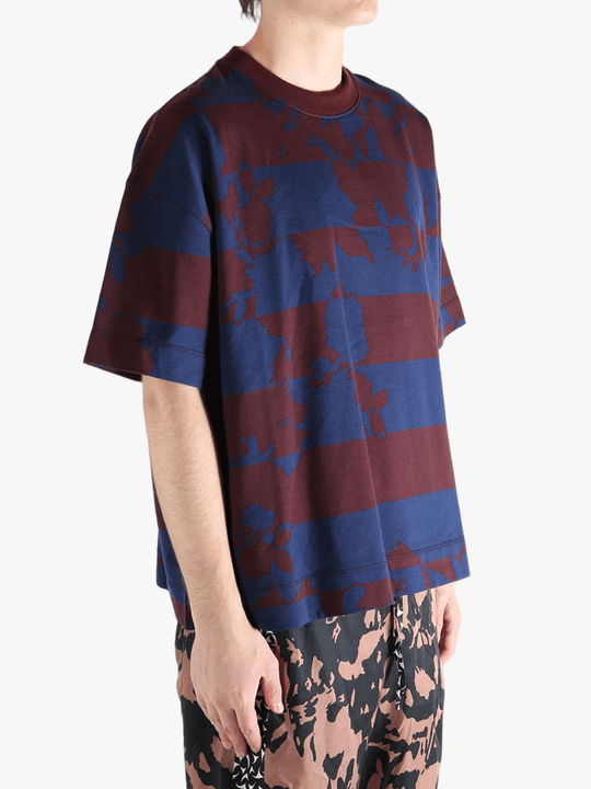 Blue t-shirt worn by a person, showing the t-shirt fit