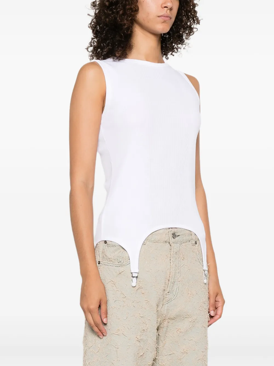 White top worn by a person, showing the top's fit