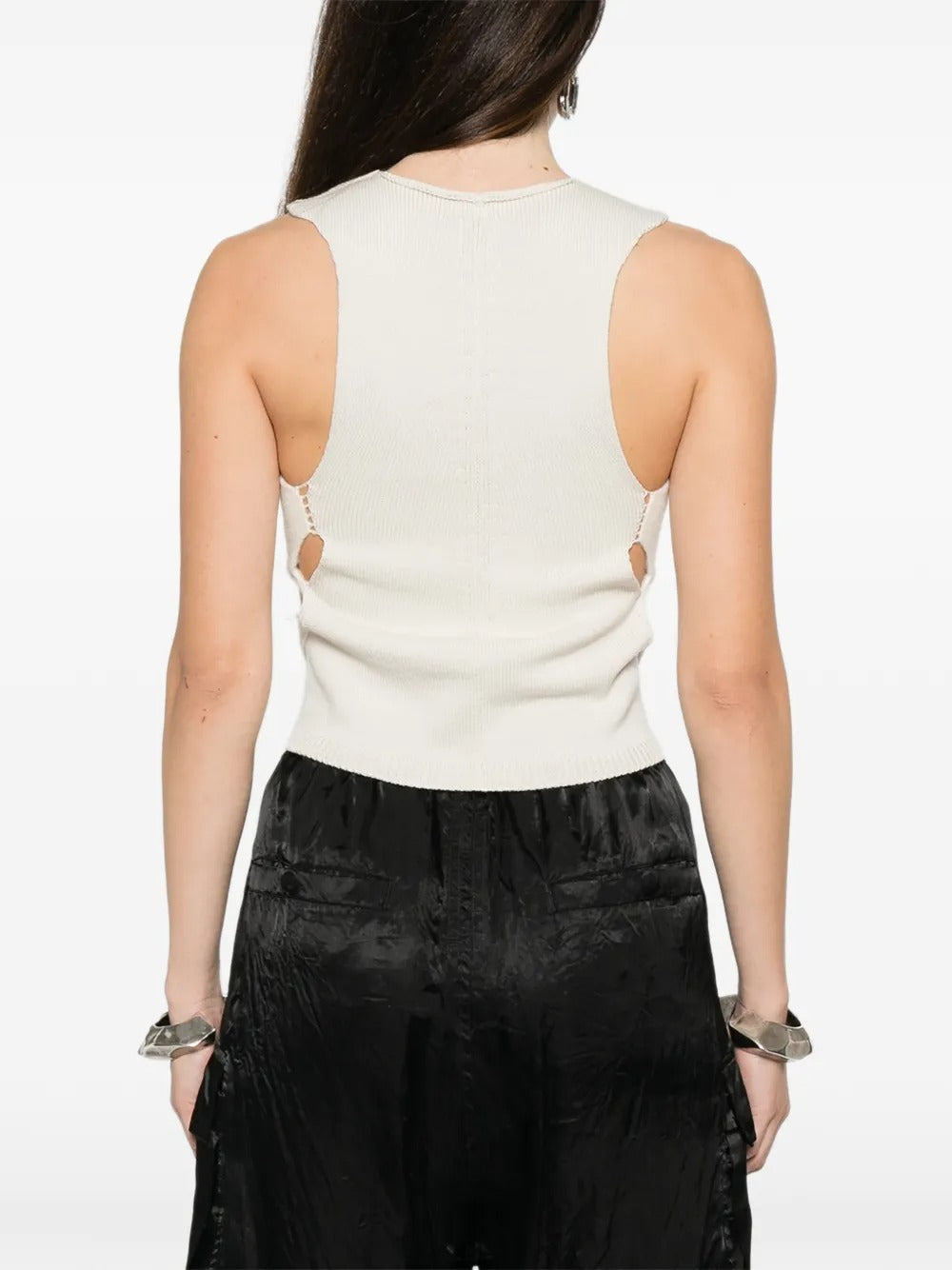White top worn by a person, showing the top's fit