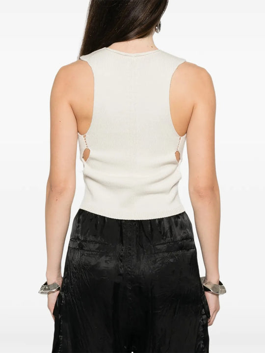 White top worn by a person, showing the top's fit