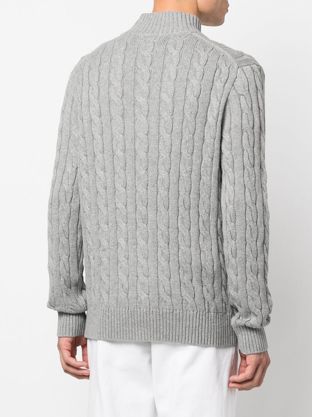Grey sweater, worn by a person, showing the sweater's fit