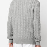 Grey sweater, worn by a person, showing the sweater's fit