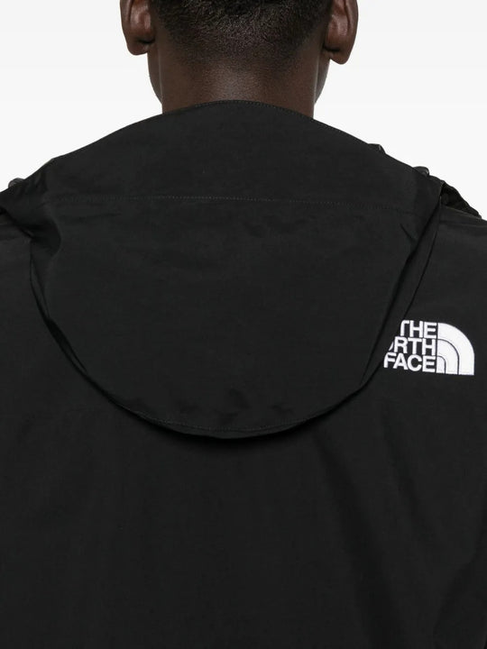 Close up of black jackets, showing texture of the polyester fabric