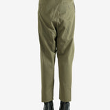 Green pants worn by a person, showing the pants's fit