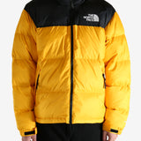 Yellow jacket worn by a person, showing the jacket's fit