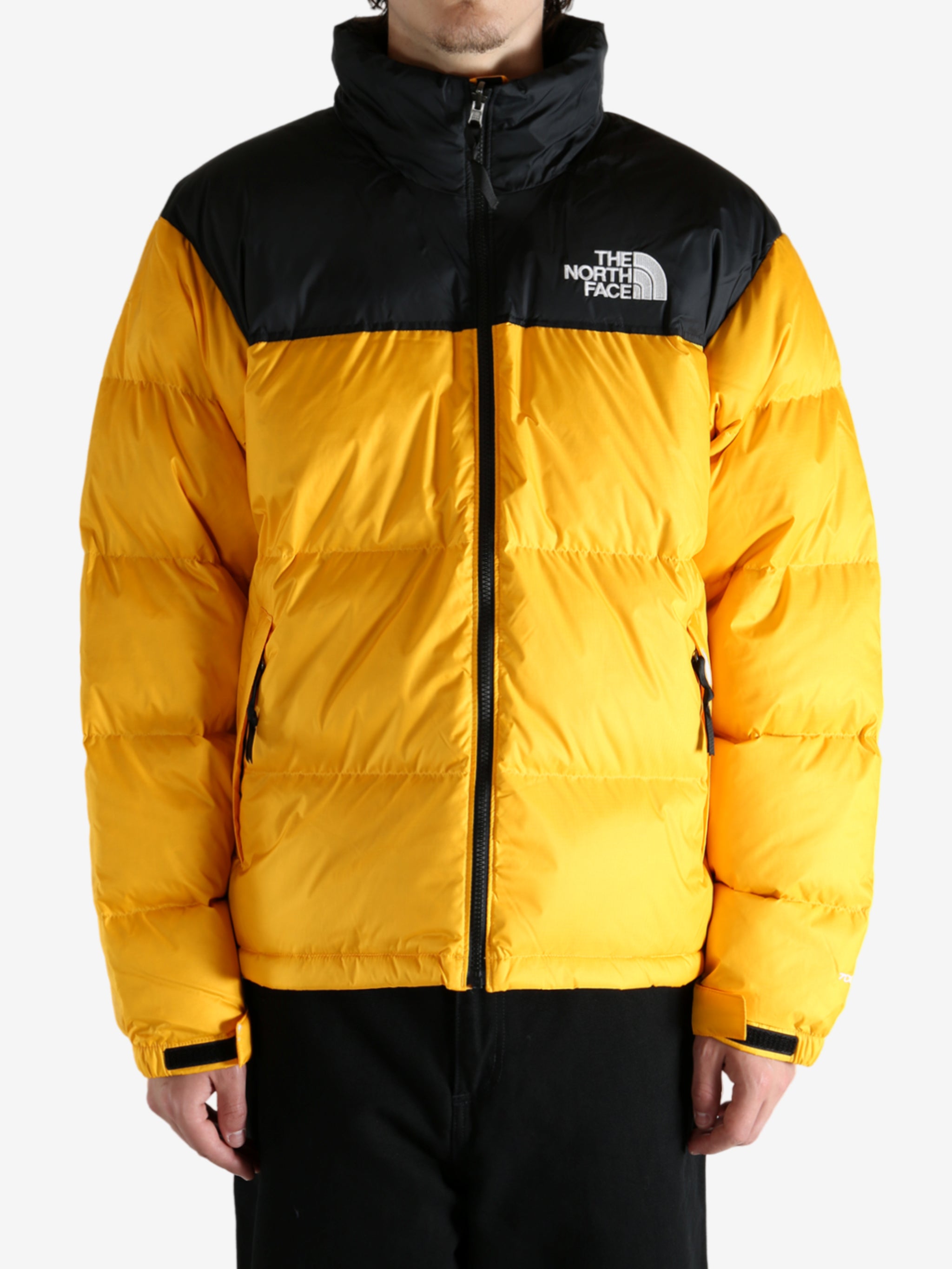 Yellow jacket worn by a person, showing the jacket's fit