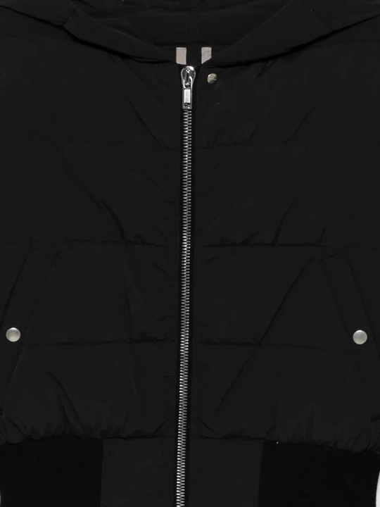 Close up of the black jacket, showing texture of the polyamide fabric