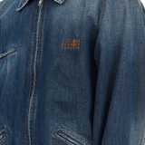 Close up of the blue jacket, showing texture of the cotton fabric