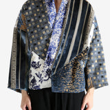 Blue coat worn by a person, showing the coat fit