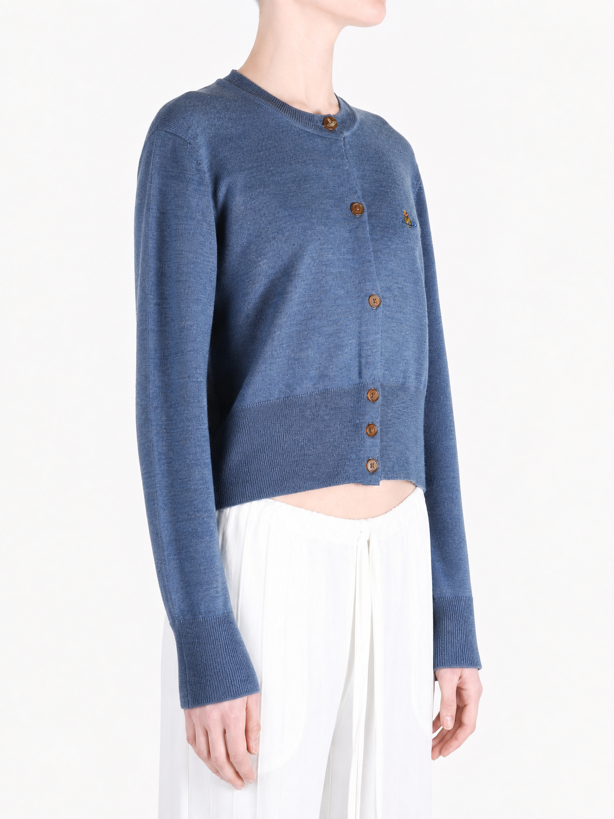 Blue knitwear worn by a person, showing the knitwear fit
