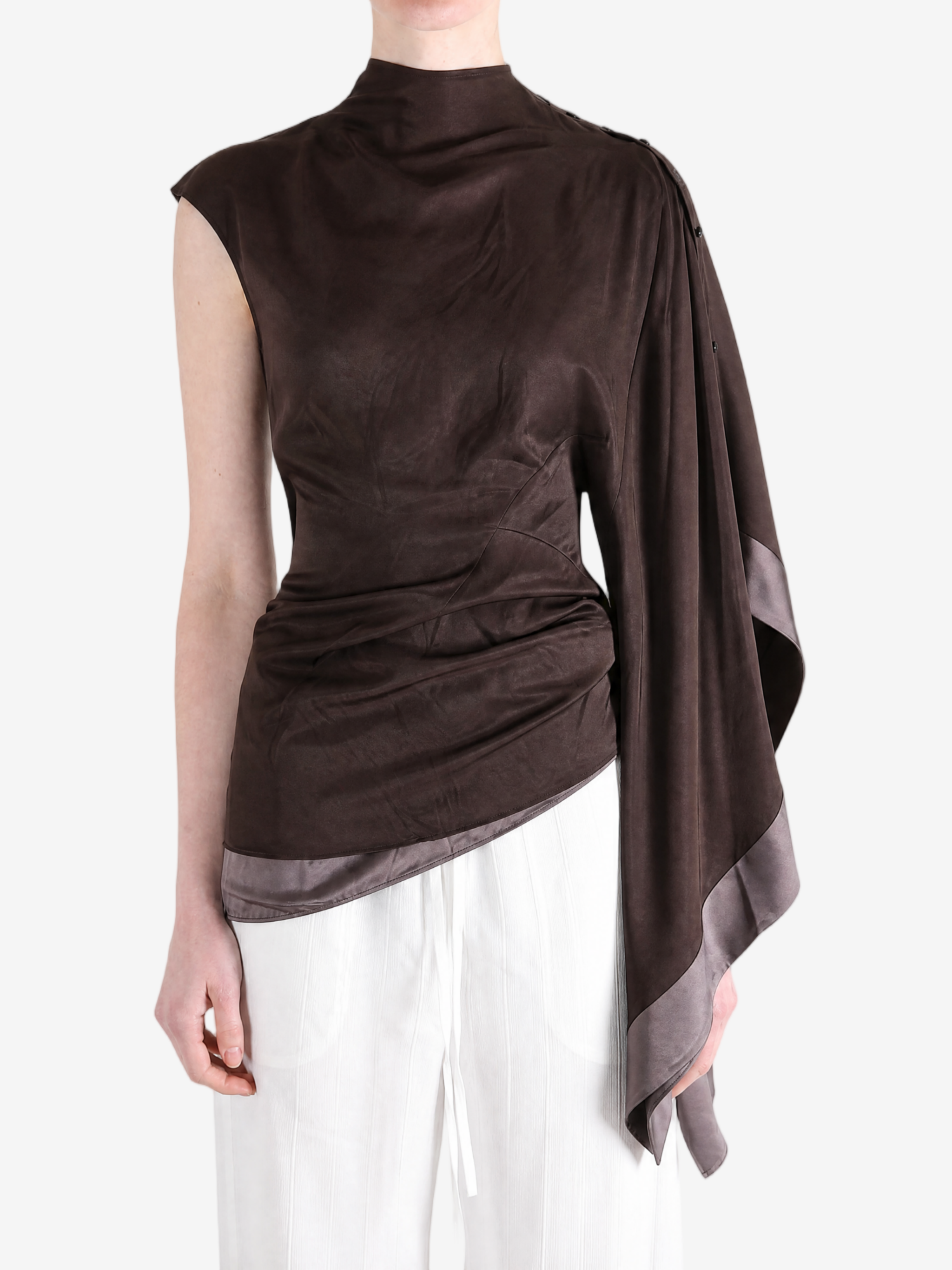 Brown top worn by a person, showing the top fit