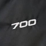 Close up of Black jacket, showing texture of the nylon fabric