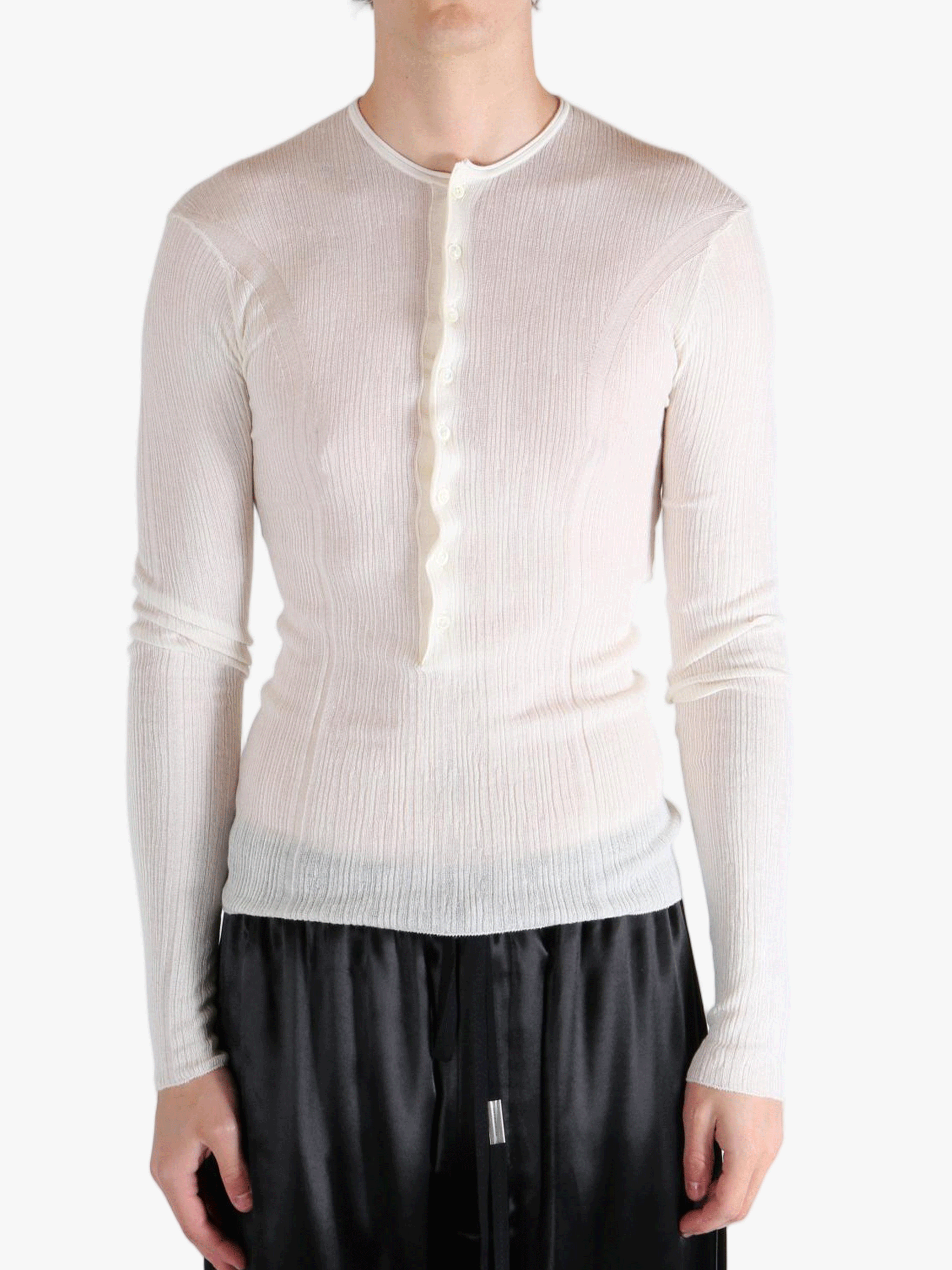 White top worn by a person, showing the top fit