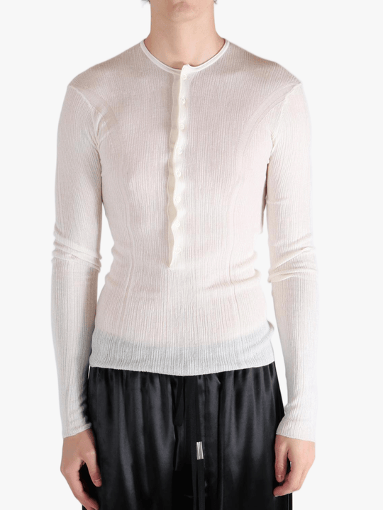White top worn by a person, showing the top fit