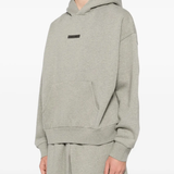Gery hoodie worn by a person, showing the hoodie fit