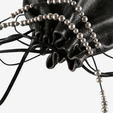 Close up of black bag, showing texture of the calf leather fabric