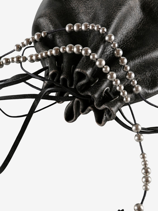 Close up of black bag, showing texture of the calf leather fabric