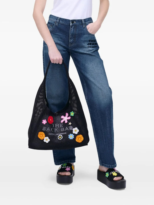 Black bag worn by a person, showing the bag's fit