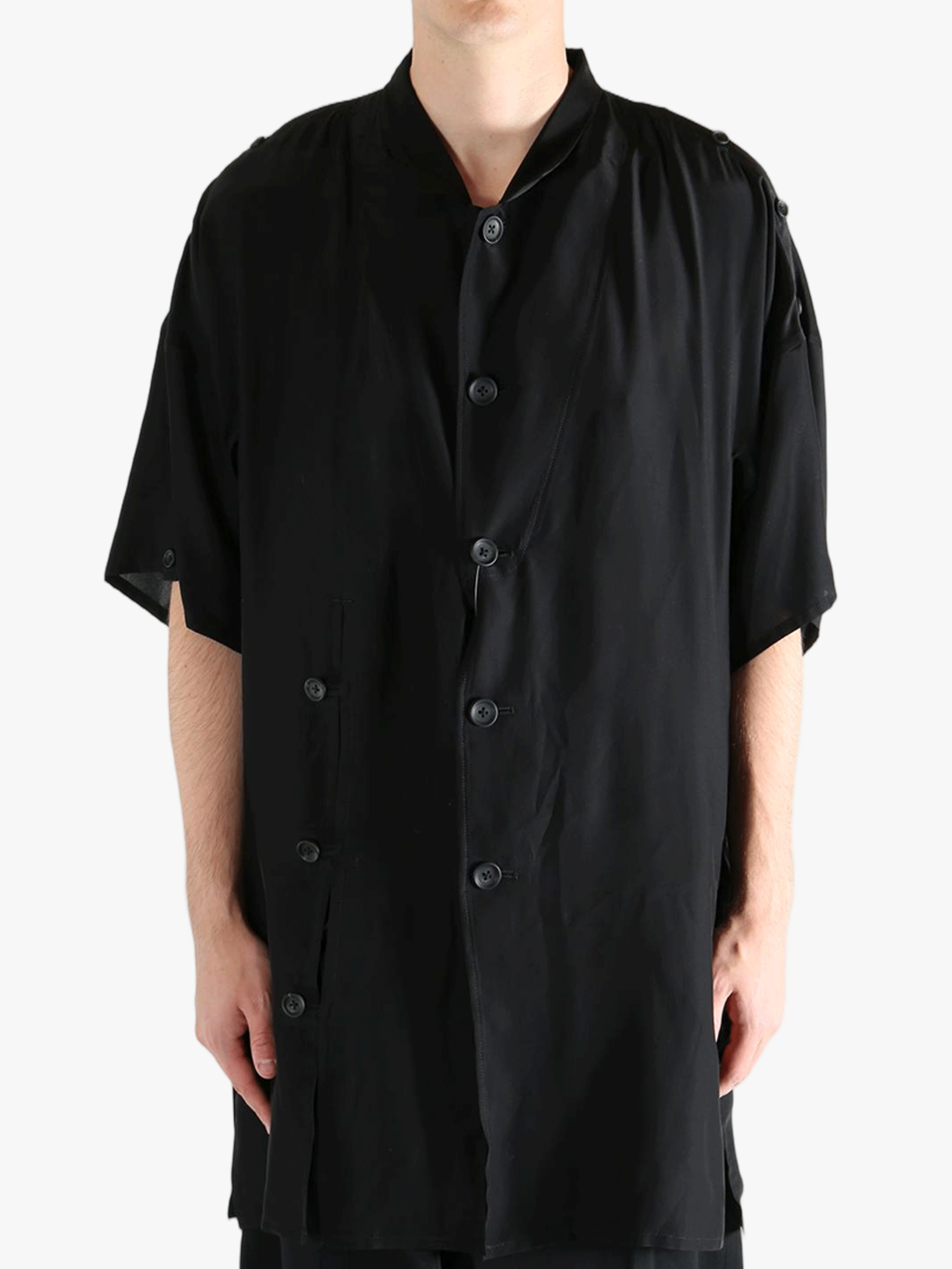 Black jacket worn by a person, showing the jacket's fit